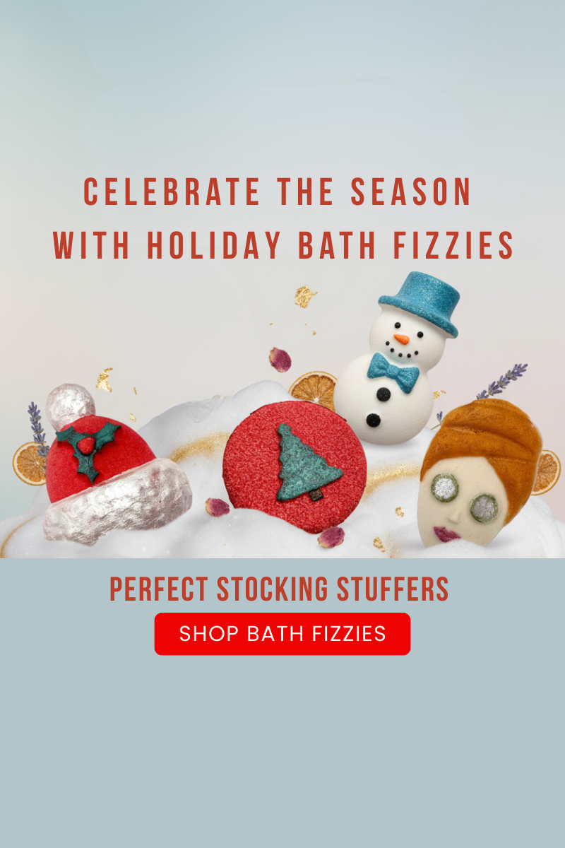 Promotional graphic for holiday bath fizzies with decorative bath bombs and text on a light blue background.