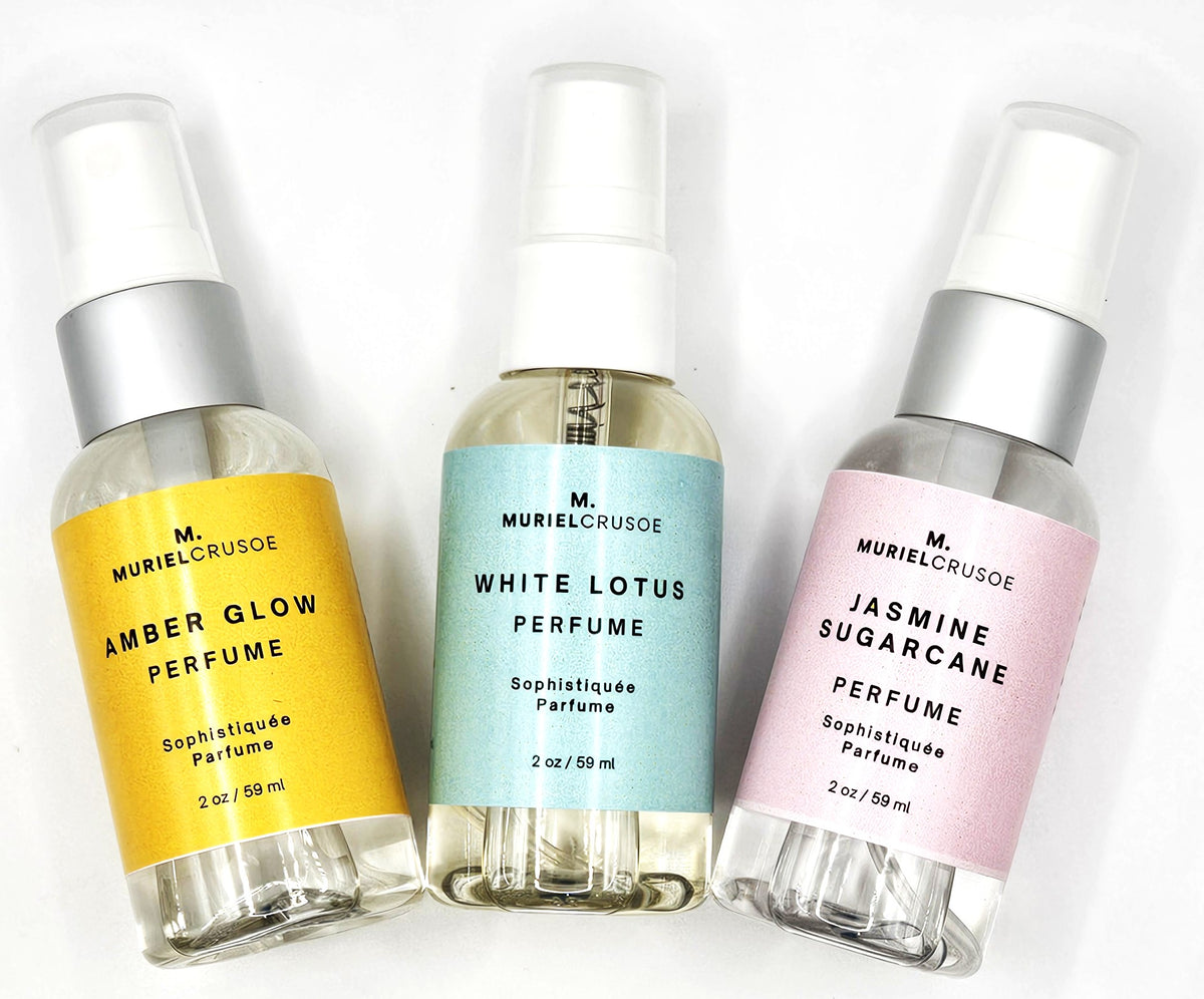 Three perfume bottles with different colored labels on a white background