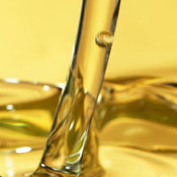 Close-up of a glass with a yellowish liquid